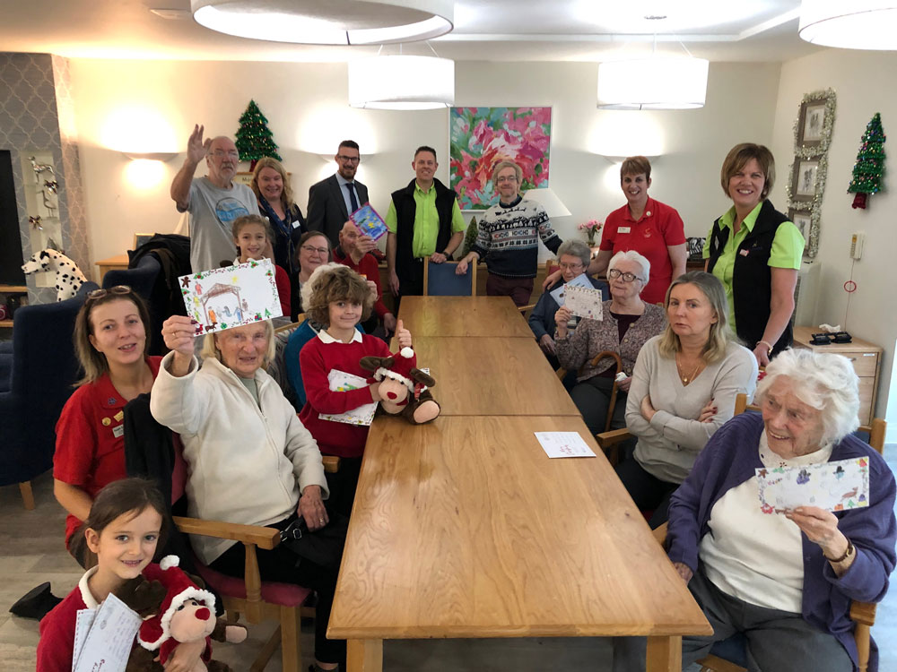 Staff-from-Haskins-in-Ferndown-with-pupils-from-Hampreston-First-School-and-residents-from-The-Aldbury-Care-Home Staff-from-Haskins-in-Ferndown-with-pupils-from-Hampreston-First-School-and-residents-from-The-Aldbury-Care-Home